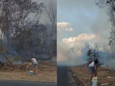 Incendio em vegetacao na Zona Sul de Teresina e uso de baldes por moradores para conter chamas